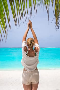 Blonde woman on the tropical beach