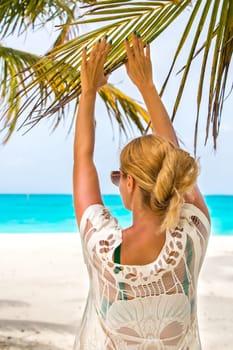 Blonde woman on the tropical beach