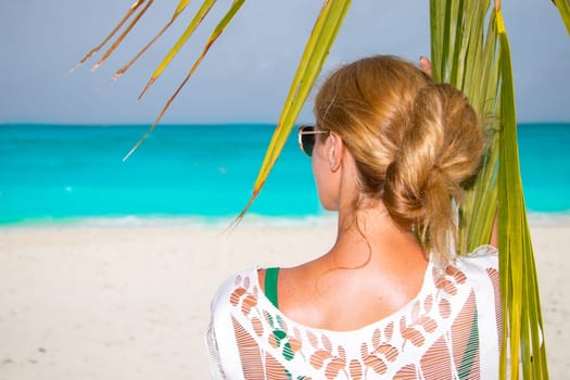 Blonde woman on the tropical beach