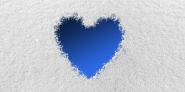 Blue Heart in front of Snow Background