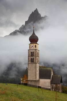san Valentino church on a foggy late autumn day, Siusi allo Sciliar, Castelrotto, Dolomites, Italy