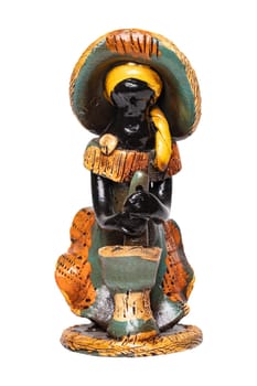 Dolls from the Dominican Republic. A traditional souvenir made from ceramic are colorful painted dolls without face. The ceramic figure isolated on a white background.