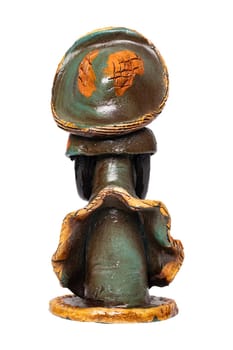 Dolls from the Dominican Republic. A traditional souvenir made from ceramic are colorful painted dolls without face. The ceramic figure isolated on a white background.
