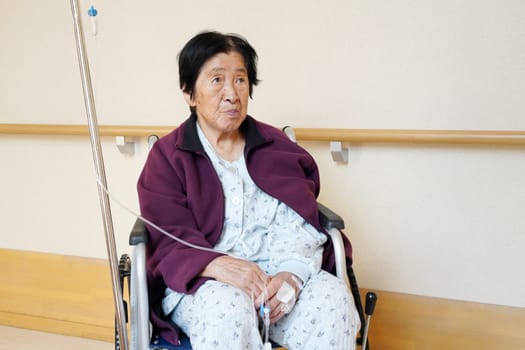 Senior or elderly woman patient on wheelchair so sad in hospital