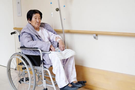 Senior or elderly woman patient on wheelchair so sad in hospital