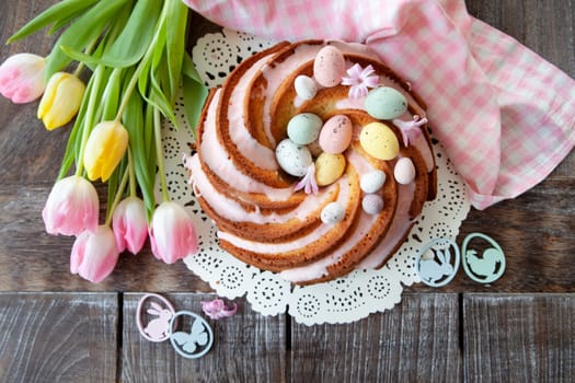 Yummy bundt cake with easter eggs and pink frosting