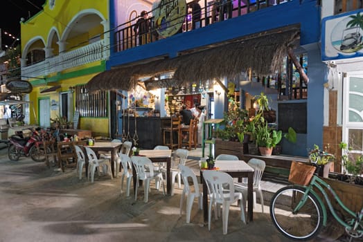 tourists in a bar on holbox island, quintana roo, mexico in the north of the yucatan peninsula