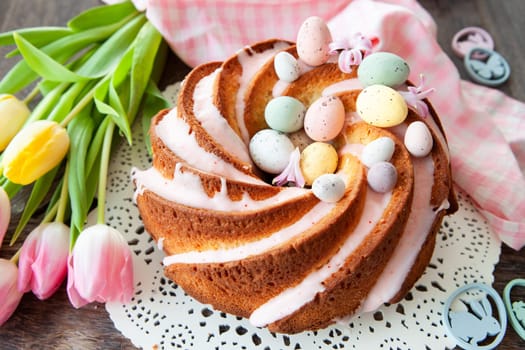 Yummy bundt cake with easter eggs and pink frosting