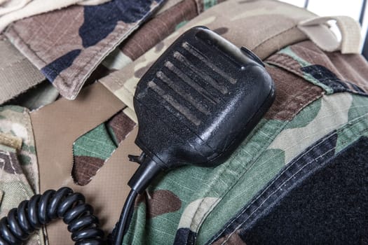 Army radio microphone on uniforms closeup shot