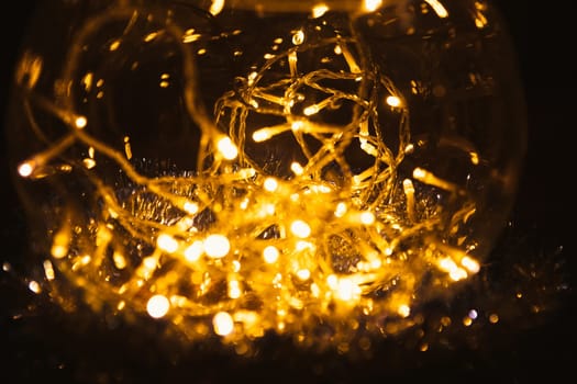 Christmas luminous garland on a dark background.