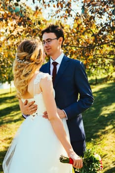 bride and groom on background summer forest.