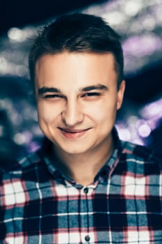 portrait of a young man on a blurred background.