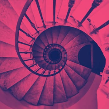 view of an ancient spiral staircase. Duotone color effect