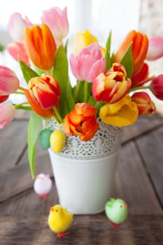 Bunch of fresh colorful tulips with easter decorations