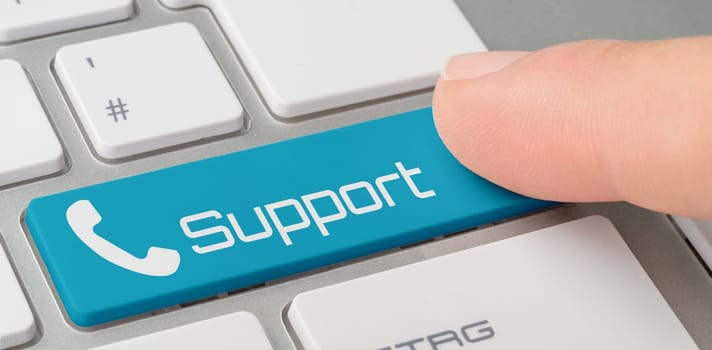 A keyboard with a blue labeled button - Support