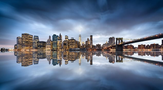 New York City skyline with urban skyscrapers at sunset, USA.