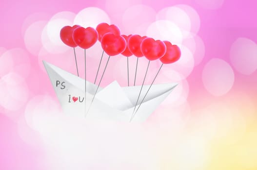 Paper boat with red heart shape balloon  flying on Blue sky and clouds. Concept Valentine's day , Sweet dream