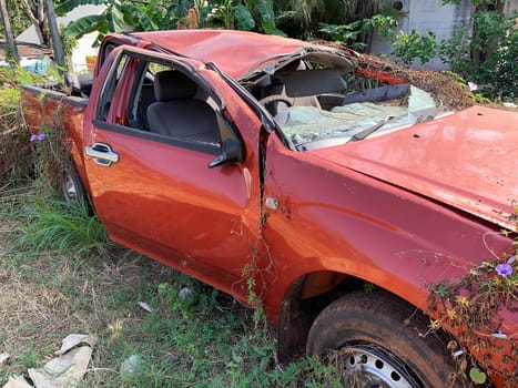 Car Wreck Environmental Disaster, forgotten damaged car with plants