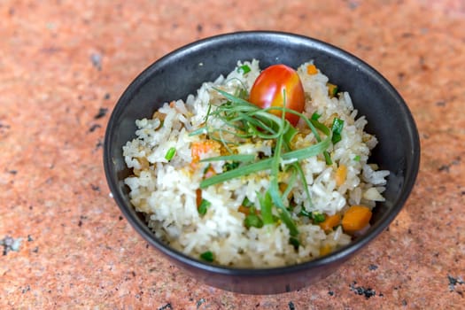 garlic fried rice in black bowl