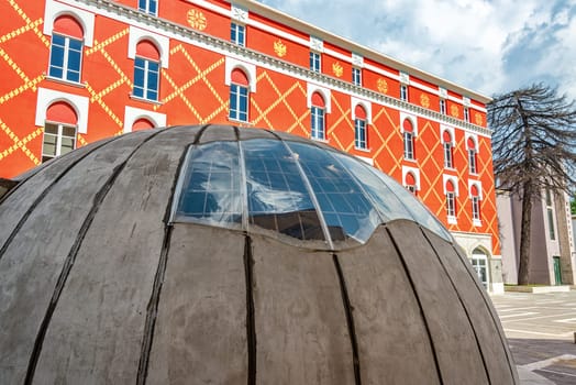 Bunker in downtown Tirana, Albania with the Ministry of Urban Development in the background