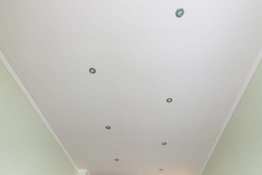 Flattened ceiling in the room, with spotlights installed