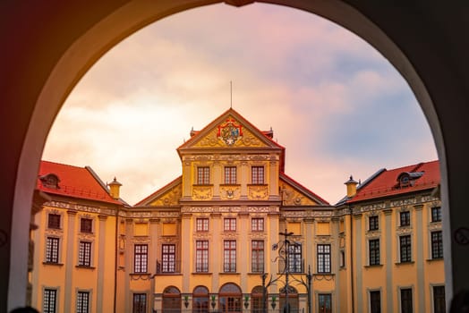 Old medieval castle in Nesvizh, Belarus, Europe. Landmark with sunset cloudy sky in background. Architecture and travel.