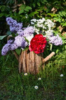 Bouquet with lilac and peony roses.
