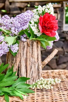 Bouquet with lilac and peony roses.