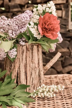 Bouquet with lilac and peony roses.
