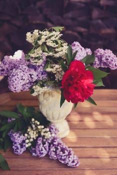 Bouquet with lilac and peony roses.