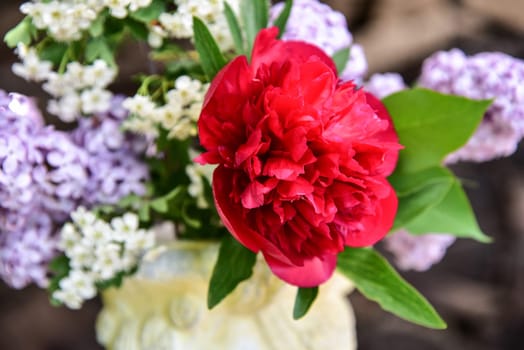 Bouquet with lilac and peony roses.