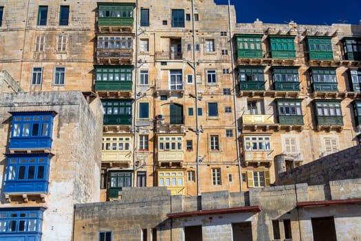 Historic architecture featuring interesting windows in medieval Valletta, Malta