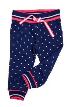 Kids pants isolated. A stylish fashionable dark blue denim trousers with white dots for the little girl. Children sport trousers.