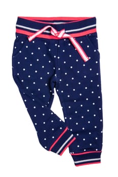 Kids pants isolated. A stylish fashionable dark blue denim trousers with white dots for the little girl. Children sport trousers.