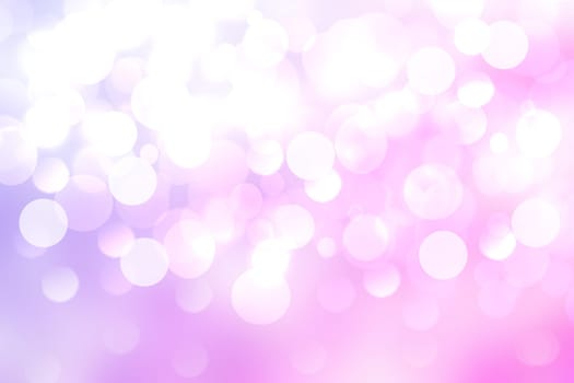 Purple bright abstract bokeh. Purple and pink gradient glowing background with bright blurred circles and glittering stars. Beautiful texture.