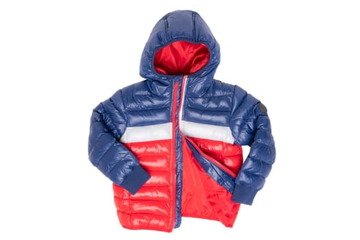 Winter jacket isolated. A stylish blue and red warm down jacket with red lining for the kids is isolated on a white background. Childrens wear with hood for spring and autumn.