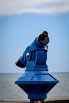 Telescope with a view of the beach