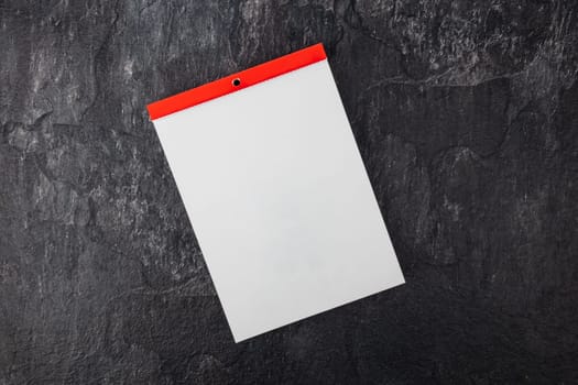 Blank Calendar from above isolated on dark background