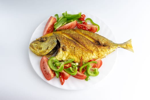 Fried fish on white background with selective focus