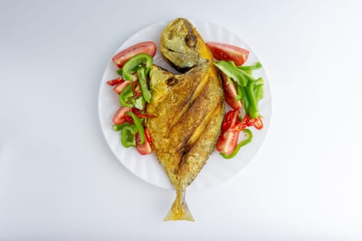 Fried fish on white background with selective focus