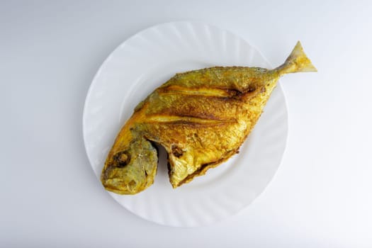 Fried fish on white background with selective focus
