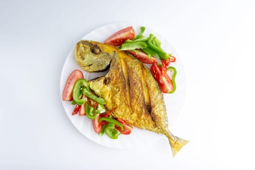 Fried fish on white background with selective focus