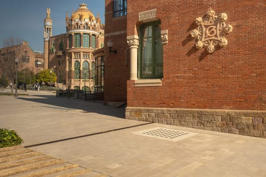 Hospital de la Santa Creu i Sant Pau, detail of a facade, St Leopold pavilion in the background, designed by the Catalan modernist architect Lluís Domènech i Montaner, Barcelona, Catalonia, Spain. UNESCO World Heritage.