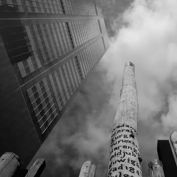"Edge of the trees"", a sculpture by Fiona Foley and Janet Laurence, black and white photo taken looking straight up at the sky, Sidney, New Wales, Australia"