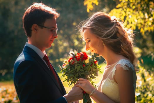 bride and groom on background summer forest.