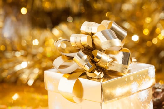 Golden Christmas background with present box