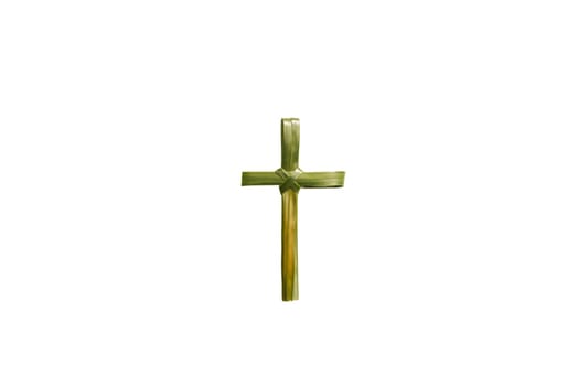 Cross shape of palm leaf isolated over white background. Palm Sunday concept