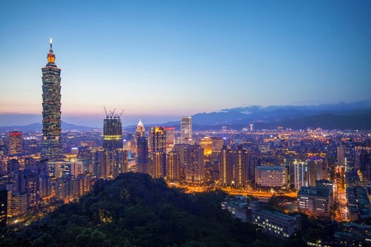 The Color cityscape with skyscraper and buildings under blue sky in night in Taipei Taiwan