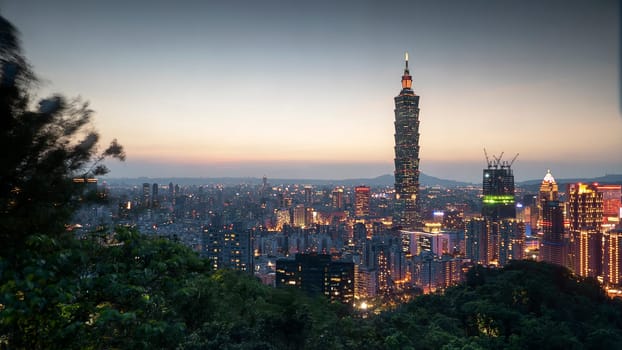 The Color cityscape with skyscraper and buildings under blue sky in night in Taipei Taiwan