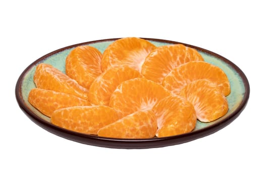 Mandarine isolated. Close-up of fresh ripe peeled mandarin orange tangerine or clementine on a plate isolated on a white background. Macro.